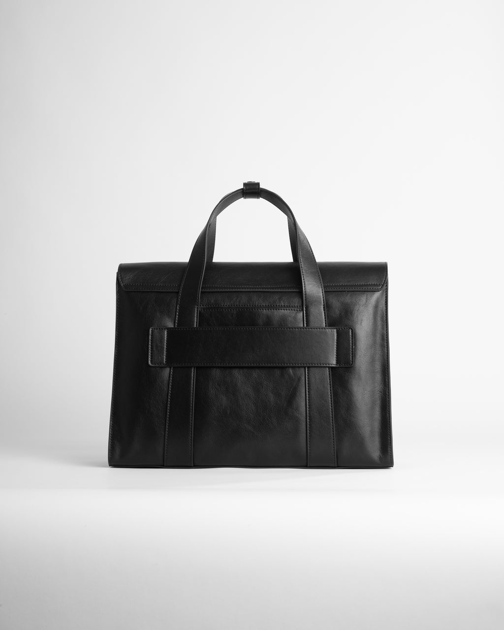 Black leather briefcase with luggage passthrough